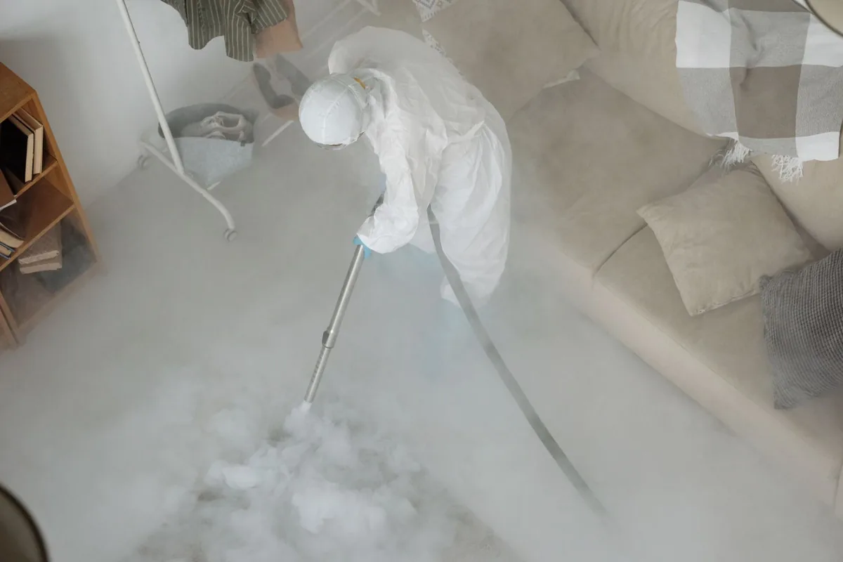 Biohazard cleanup technician in protective equipment, Port Huron, MI